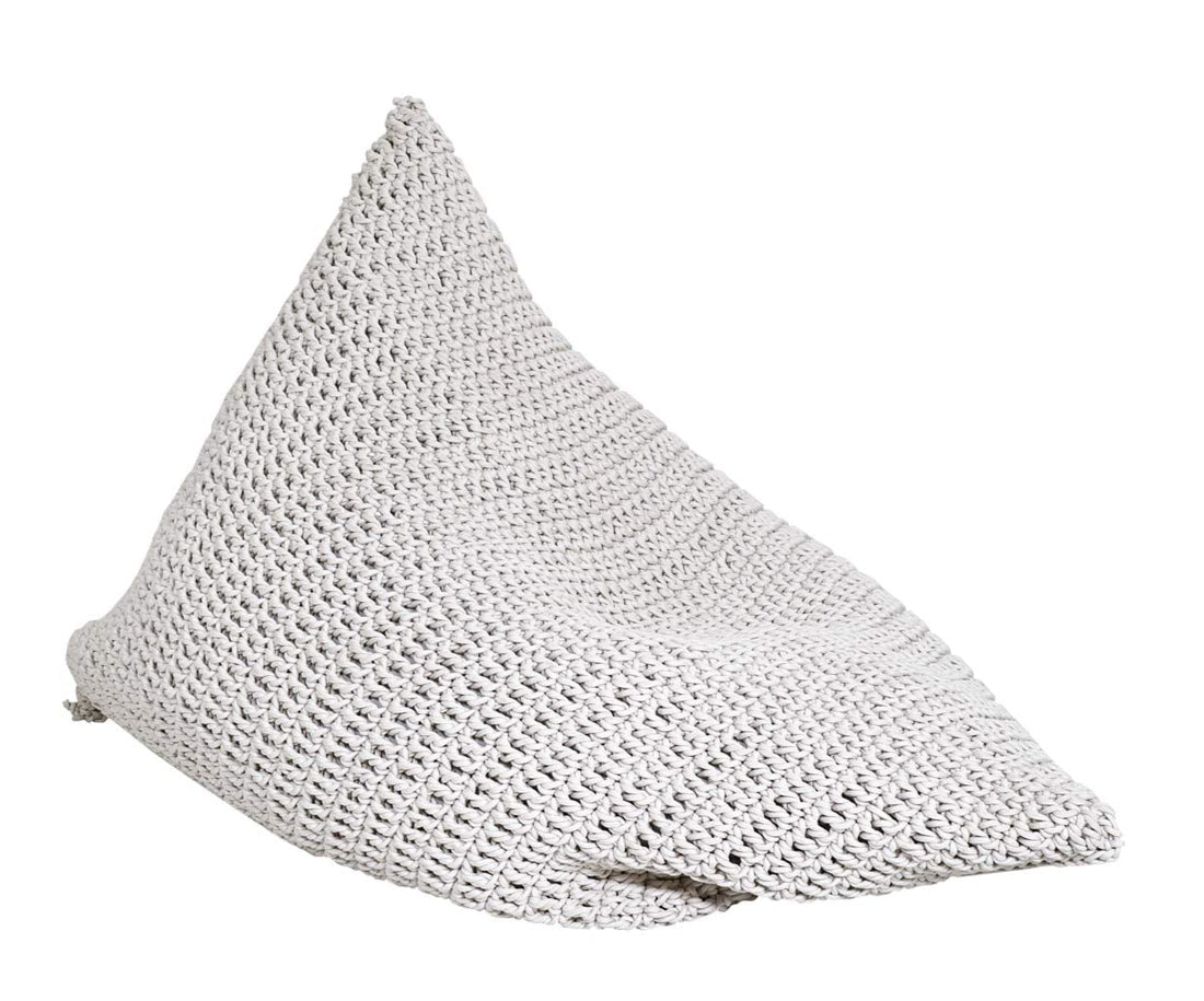 Textured gray bean-shaped pillow on a white background
