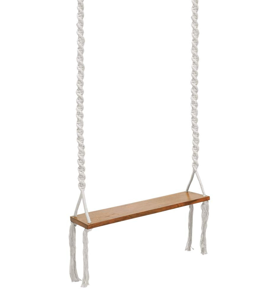 Wooden swing with white ropes on a white background