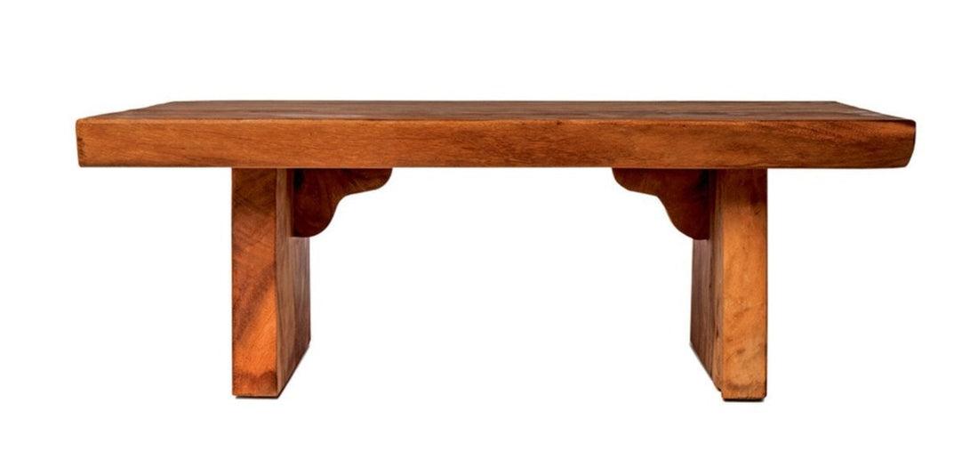 A rectangular coffee table made of solid suar wood with visible natural wood grain.