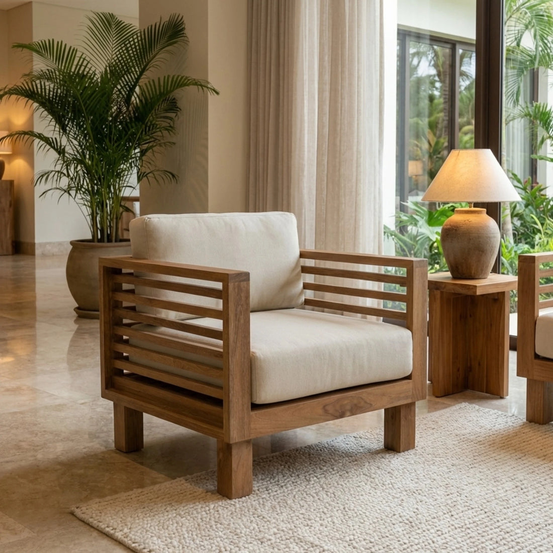 Wooden armchair with beige cushions in a modern living room setting.