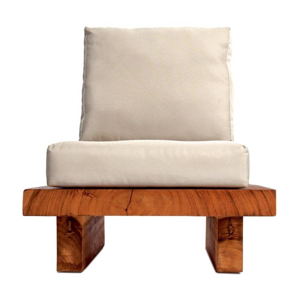 A low dining chair made of Suar wood with a beige cushion 