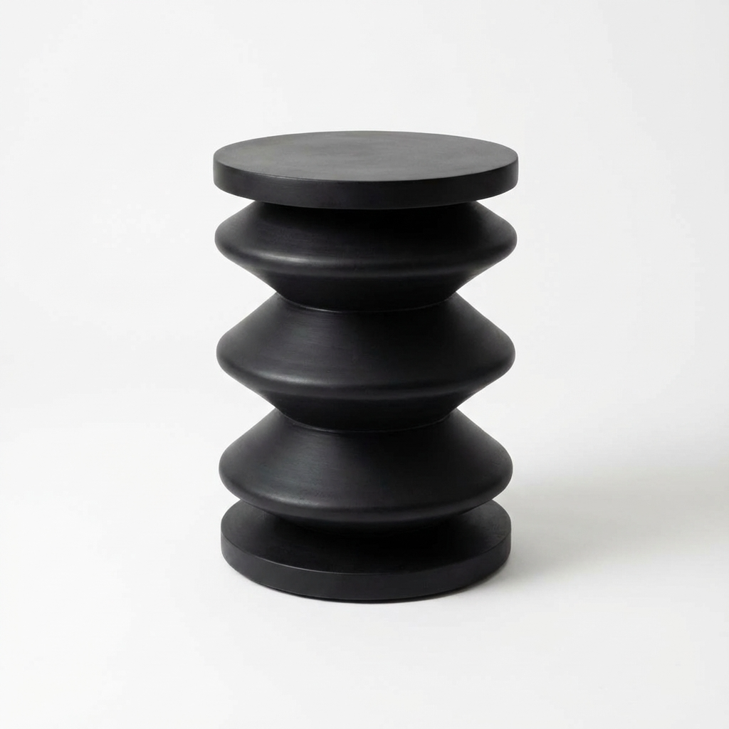 Black side table with layered design on a white background