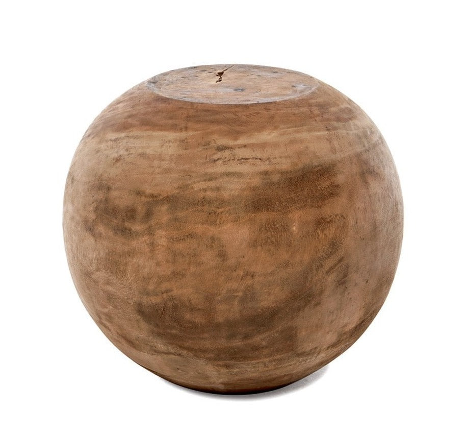 A brown round side table made of suar wood