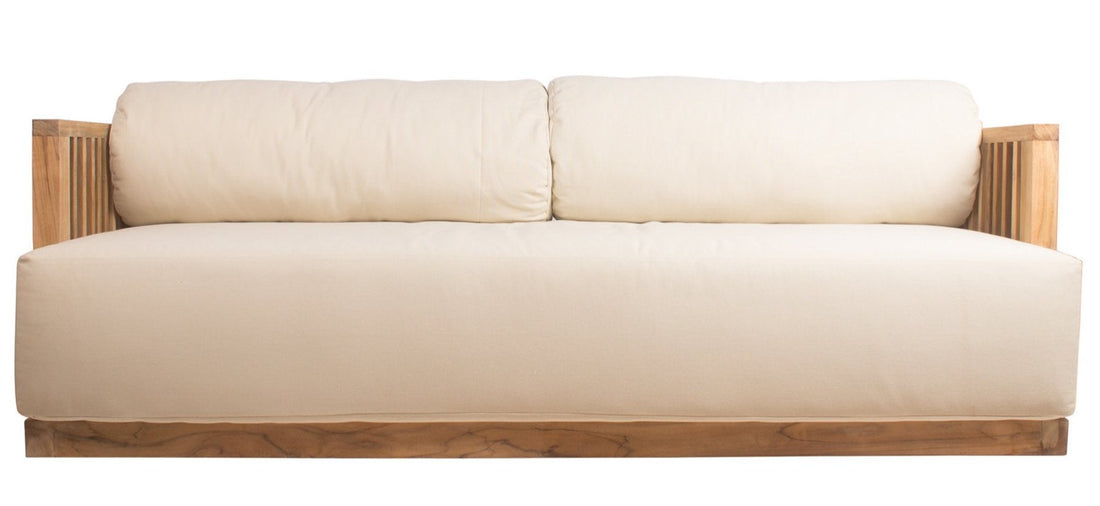 A beige cushioned sofa with a teak wood frame, viewed from a front angle.